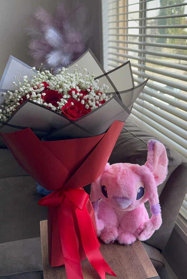 A dozen red roses with baby’s breath + Pink Stitch