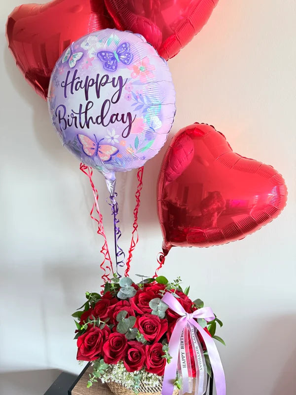 24 Red Roses & Eucalyptus stems in a Basket & 4 Balloons