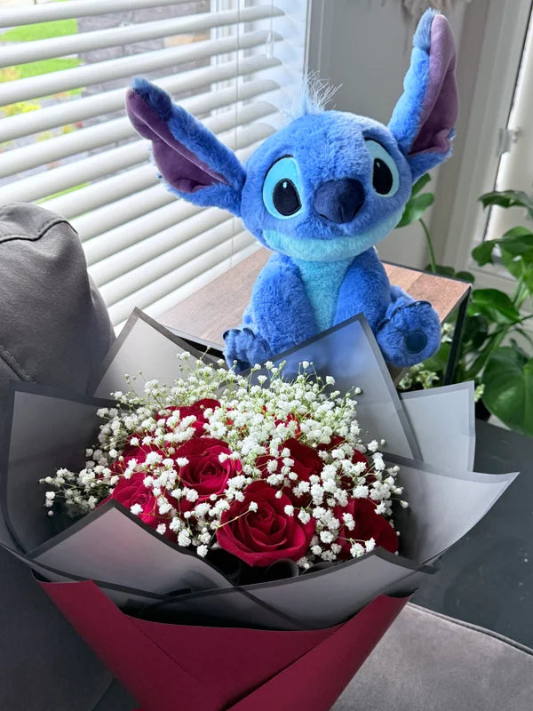 A dozen red roses with baby’s breath & Blue Stitch