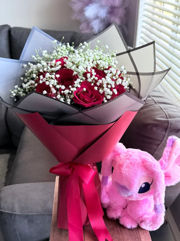 A dozen red roses with baby’s breath + Pink Stitch
