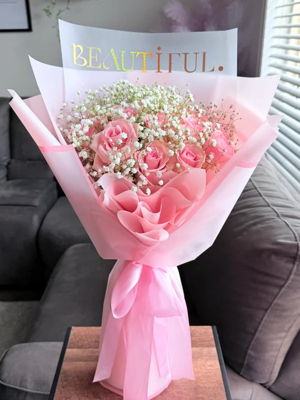 12 Pink Roses with baby’s breath