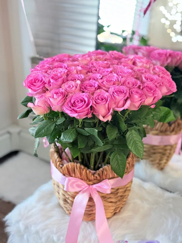 A blooming basket of 50 pink roses.